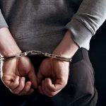 hands-locked-in-handcuffs-felony-arrest-768x512