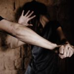 She shielded her throat with her arm and fought him off