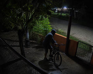 Owner watches from parked car as man mounts his bike