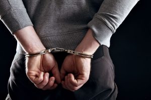 hands-locked-in-handcuffs-felony-arrest