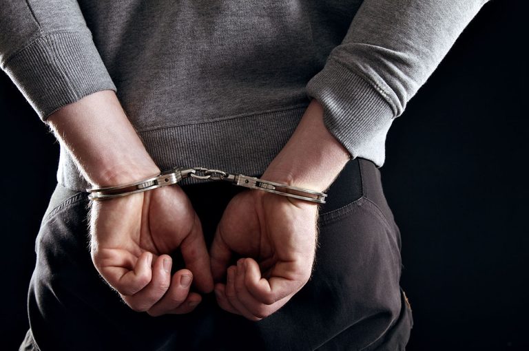 hands-locked-in-handcuffs-felony-arrest