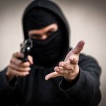 Store owner pistol-whipped and kicked during $6,000 robbery