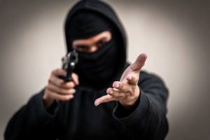 Store owner pistol-whipped and kicked during $6,000 robbery