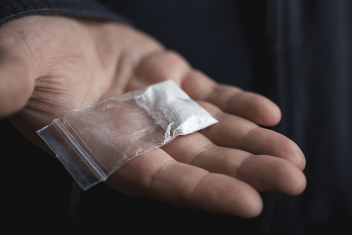Police tip uncovers 24 live rounds and cocaine stash in Orange Walk