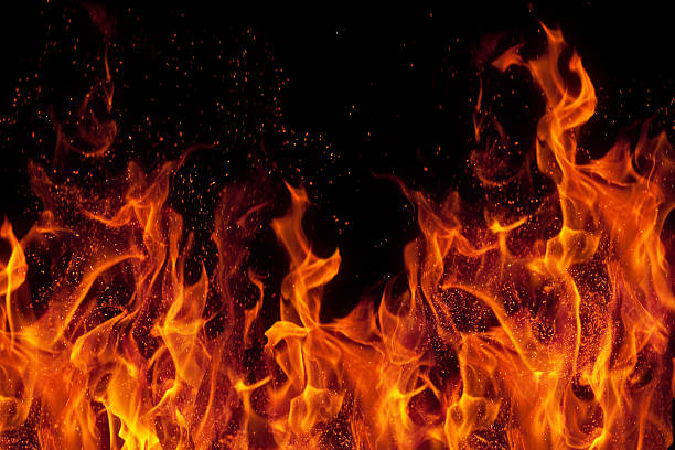 fire Woman escapes fire by jumping through bathroom windowover black background
