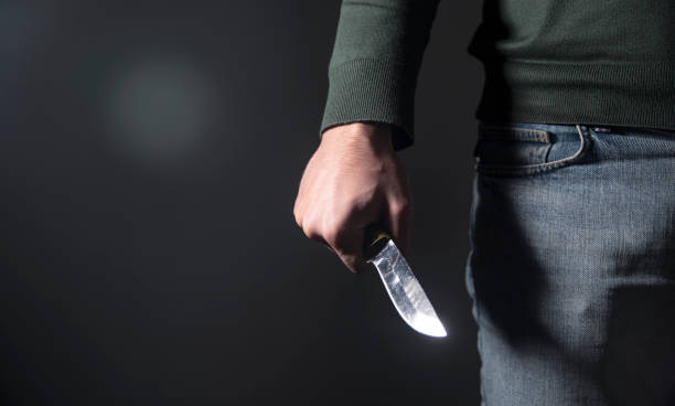 Officer draws revolver as man waves knife in Guinea Grass